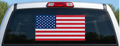 Illustrative American flag decal on pickup truck rear window